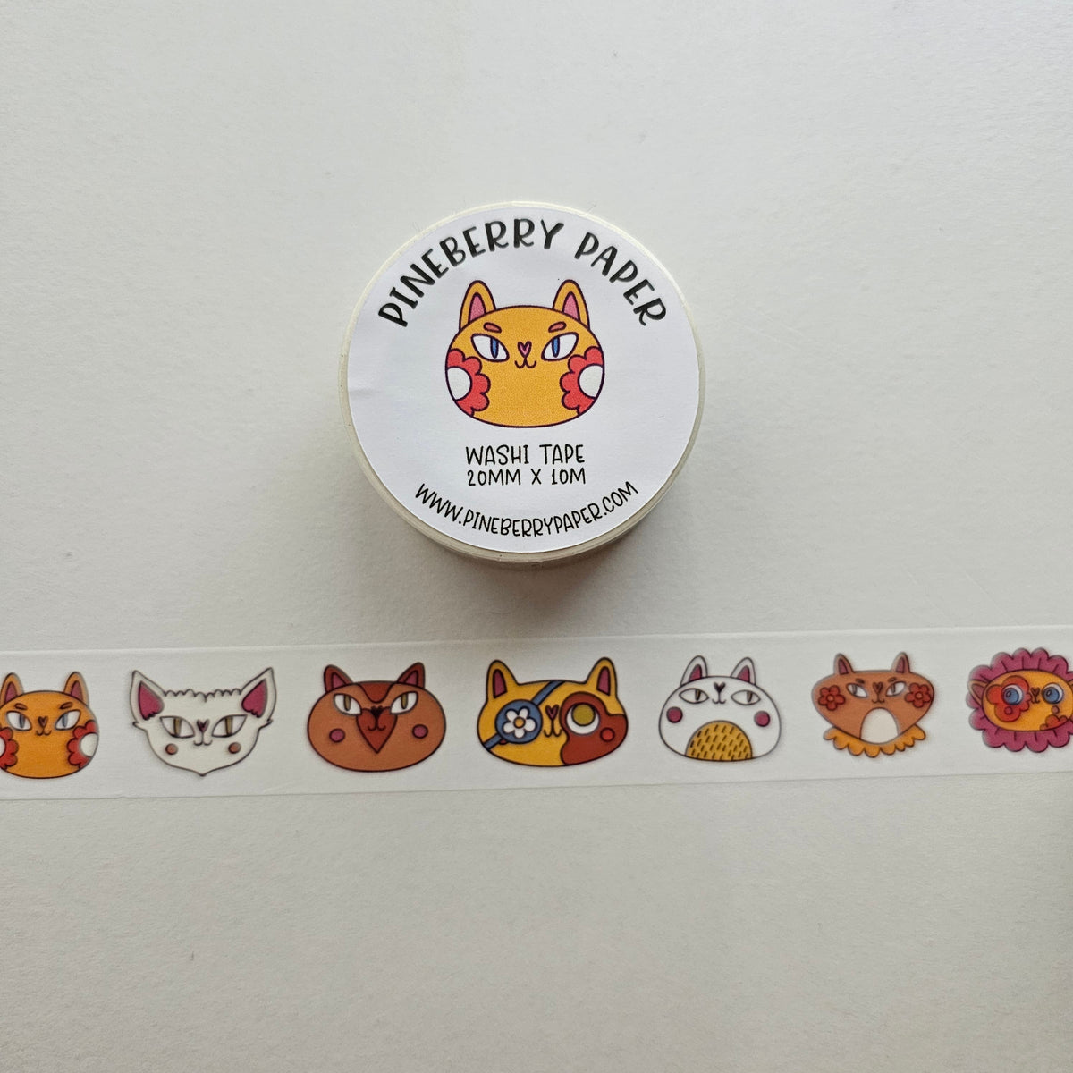 Washi tape with cat designs and Pineberry Paper branding on a white background