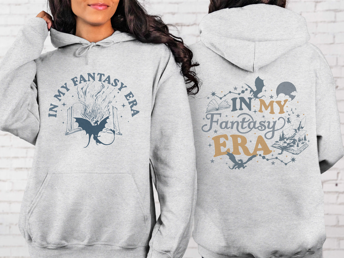 Gray hoodie with 'In My Fantasy Era' text and design on front and back, worn by a person.