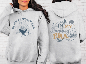 Gray hoodie with 'In My Fantasy Era' text and design on front and back, worn by a person.