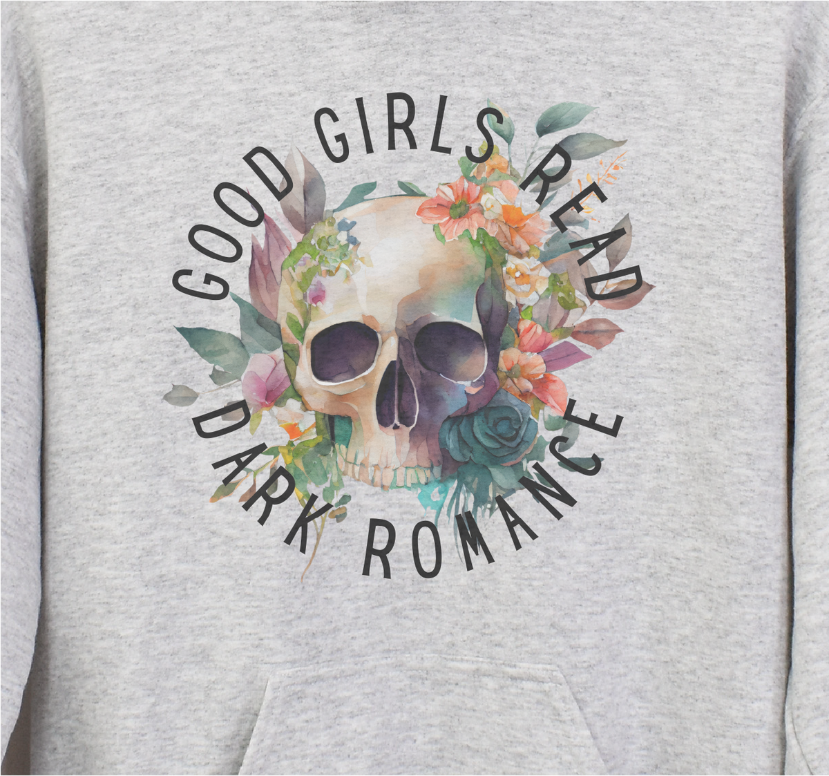 Gray sweatshirt with a skull design and text 'Good Girls Read Dark Romance' on a plain background