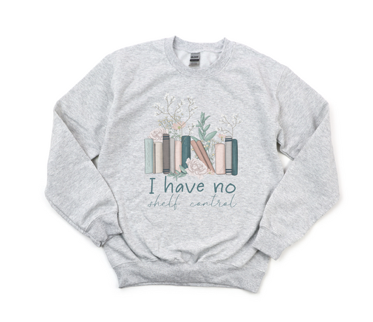 Gray sweatshirt with book-themed design and text on a white background