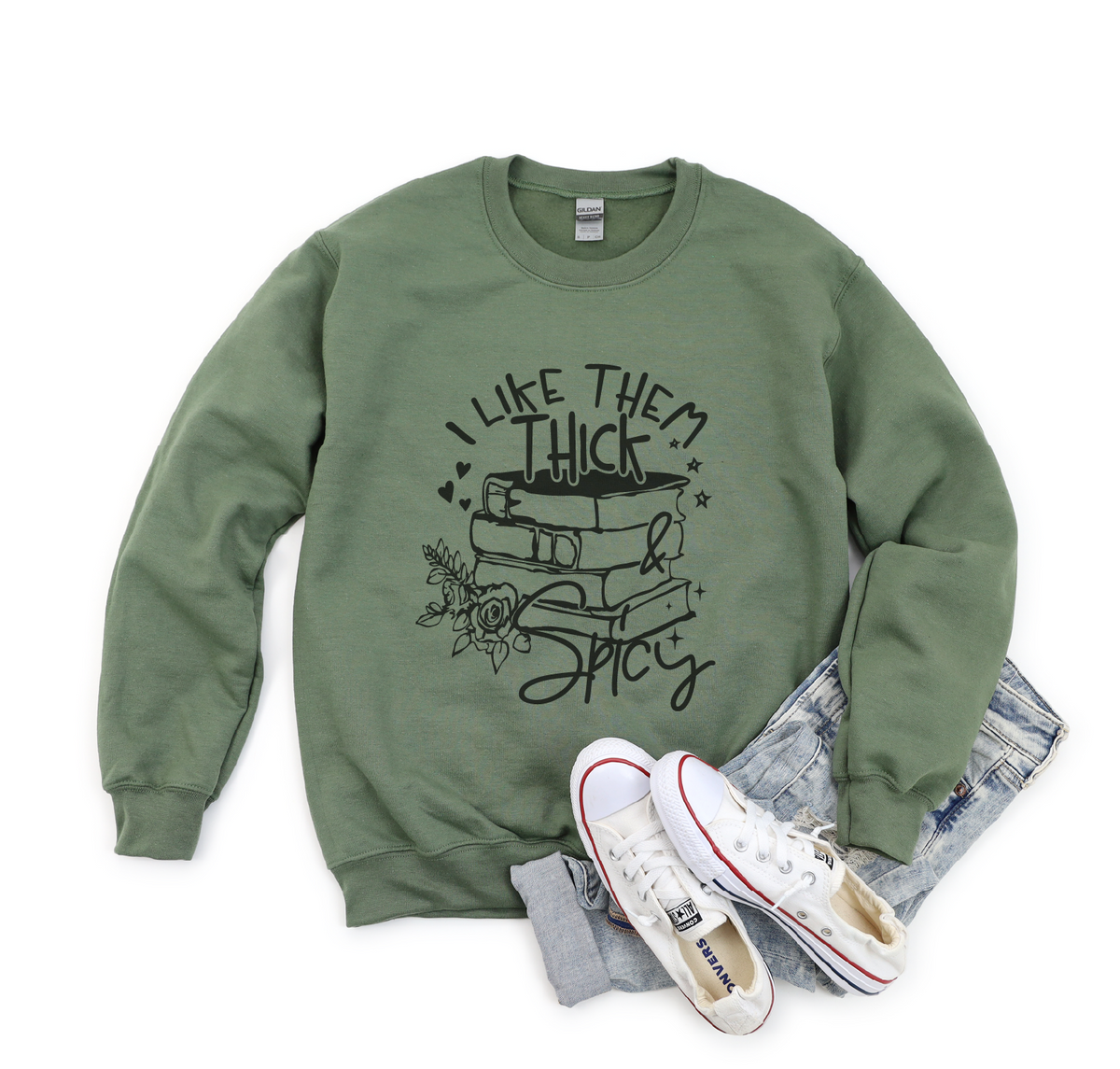 Green sweatshirt with text and graphics, paired with white sneakers and gray pants on a white background