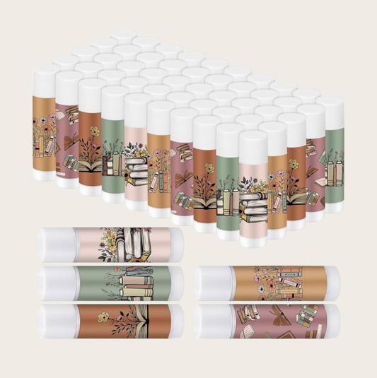 Multiple lip balms with decorative packaging on a white background