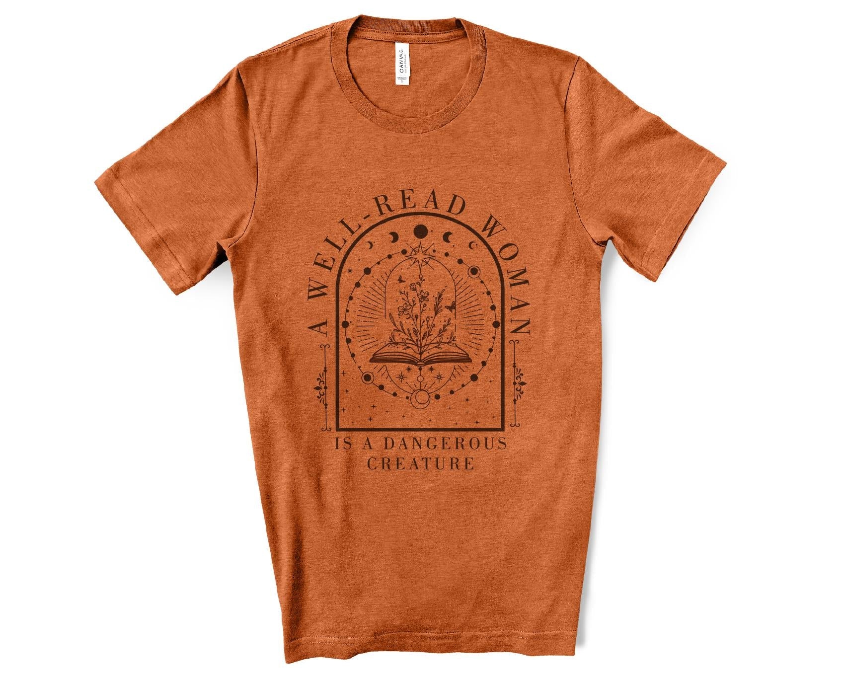 Orange t-shirt with 'A Well-Read Woman is a Dangerous Creature' text and graphic on a white background