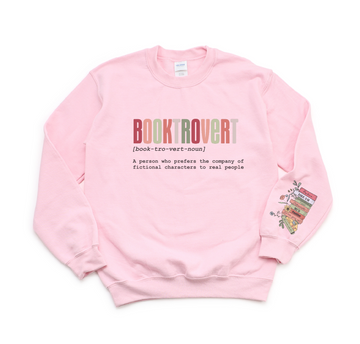 Pink sweatshirt with 'BOOKTROVERT' text and definition on a white background