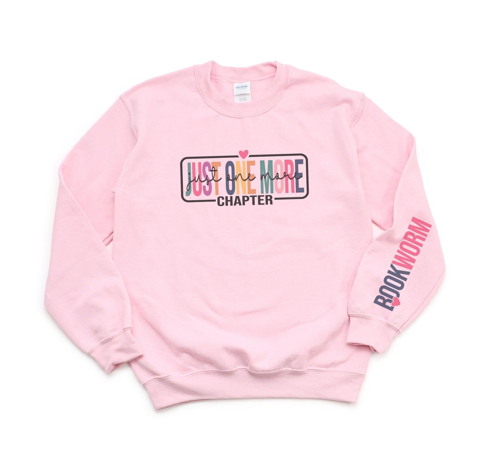 Pink sweatshirt with text design on a white background