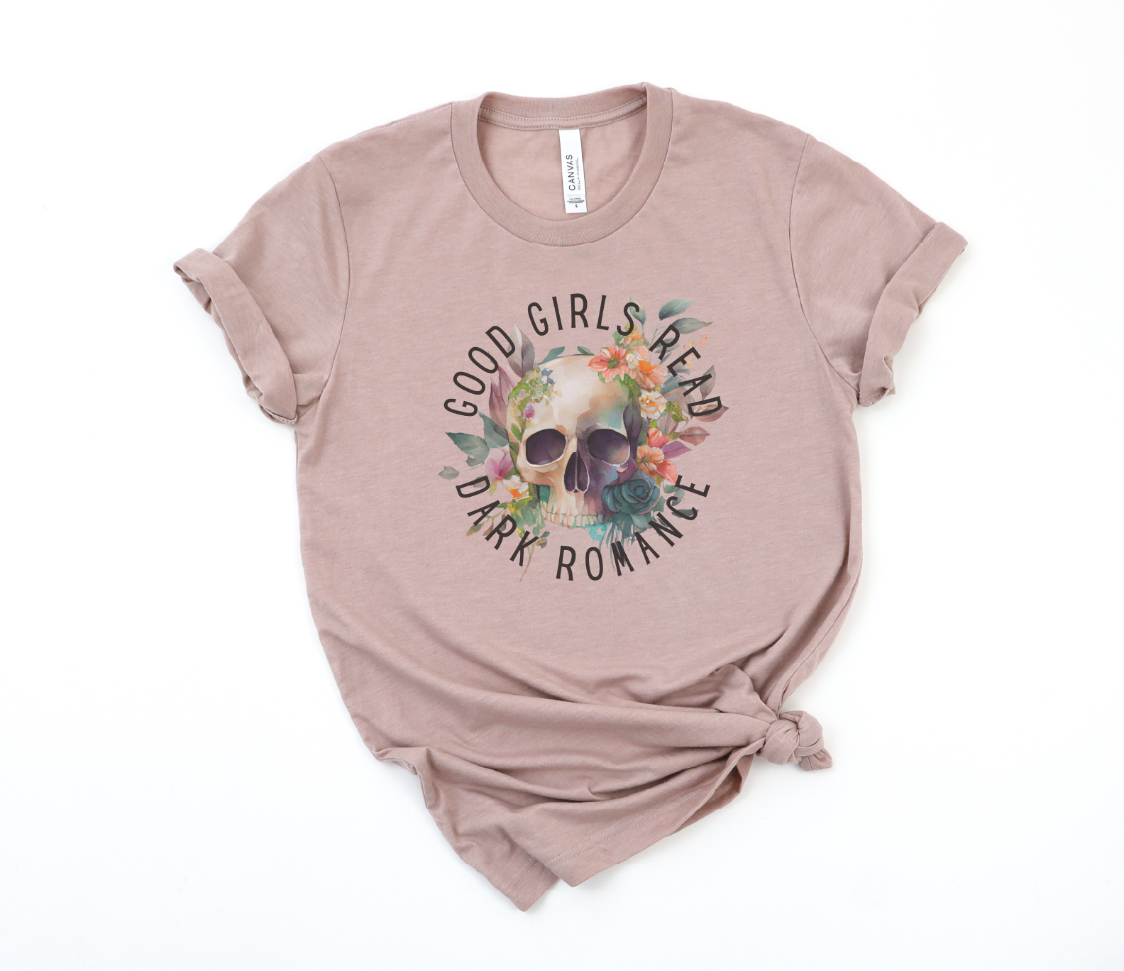 Pink t-shirt with skull design and text on a white background