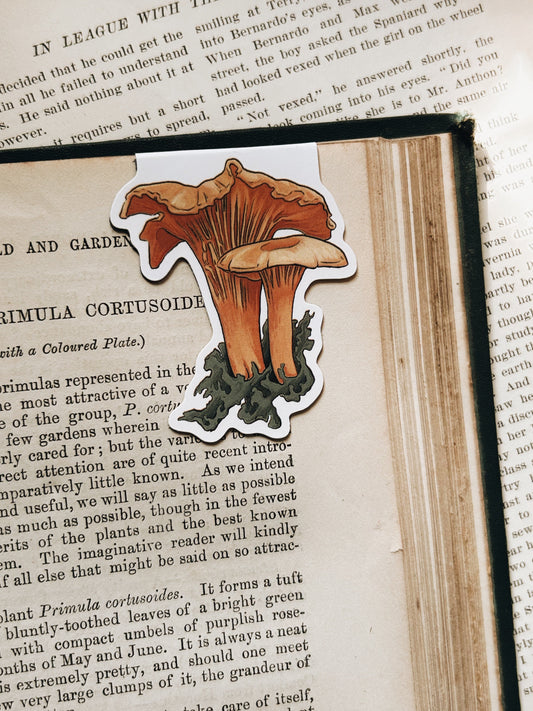 Sticker of mushrooms on a book page with text