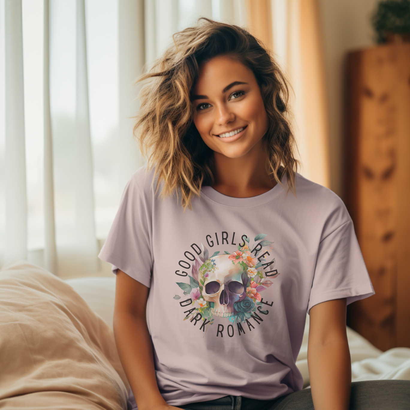 Woman wearing a purple t-shirt with a graphic design and text, sitting on a couch.