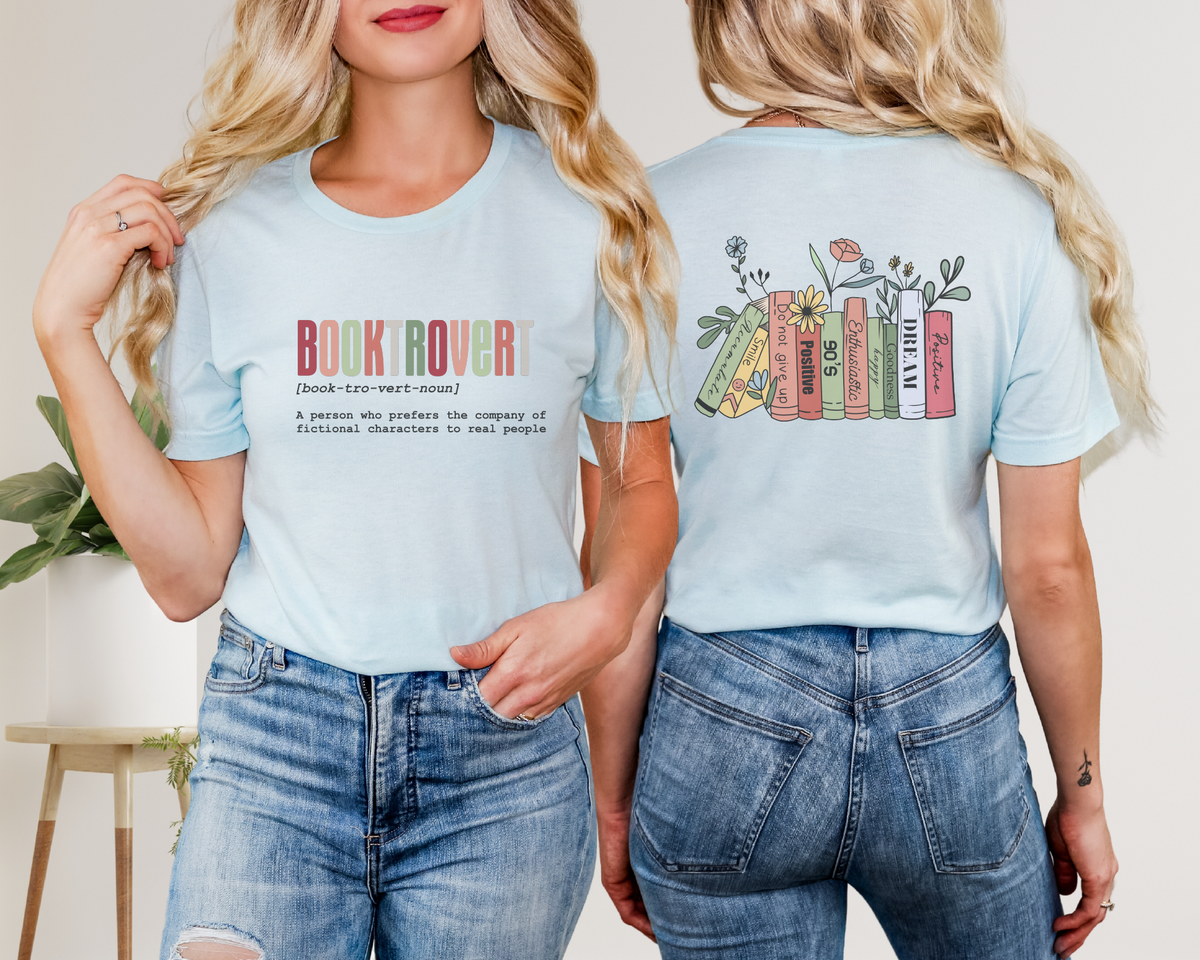 Person wearing a light blue t-shirt with 'Book Rover' text and colorful book design on the back.