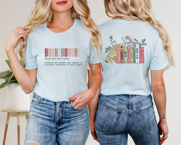 Person wearing a light blue t-shirt with 'Book Rover' text and colorful book design on the back.