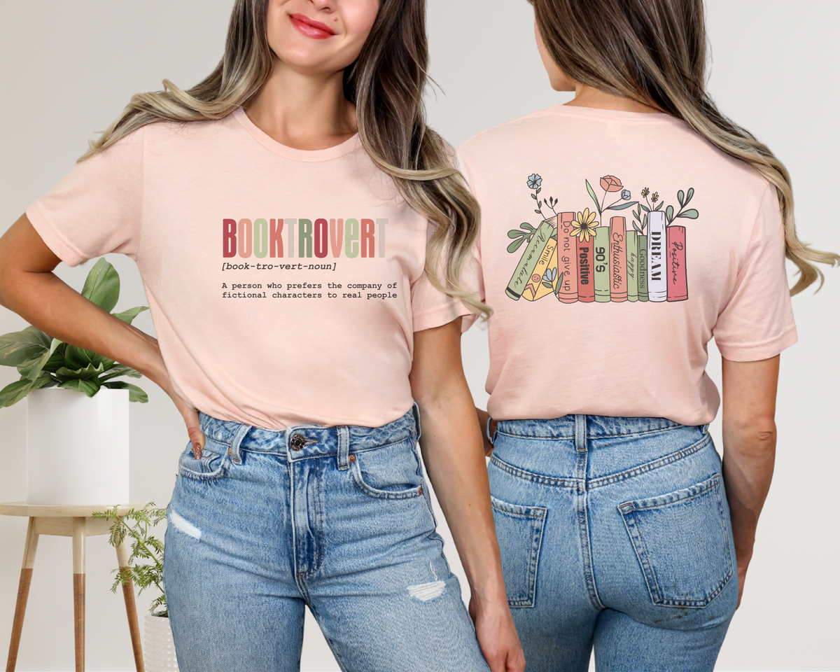 Person wearing a pink t-shirt with 'book lover' text and book illustration on the back.